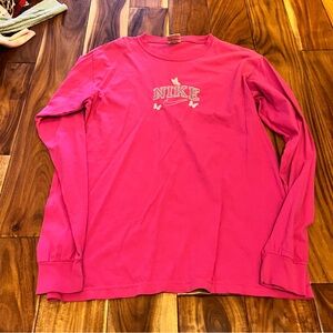 Women’s pink embroidered Nike butterflies long sleeve top. Size medium